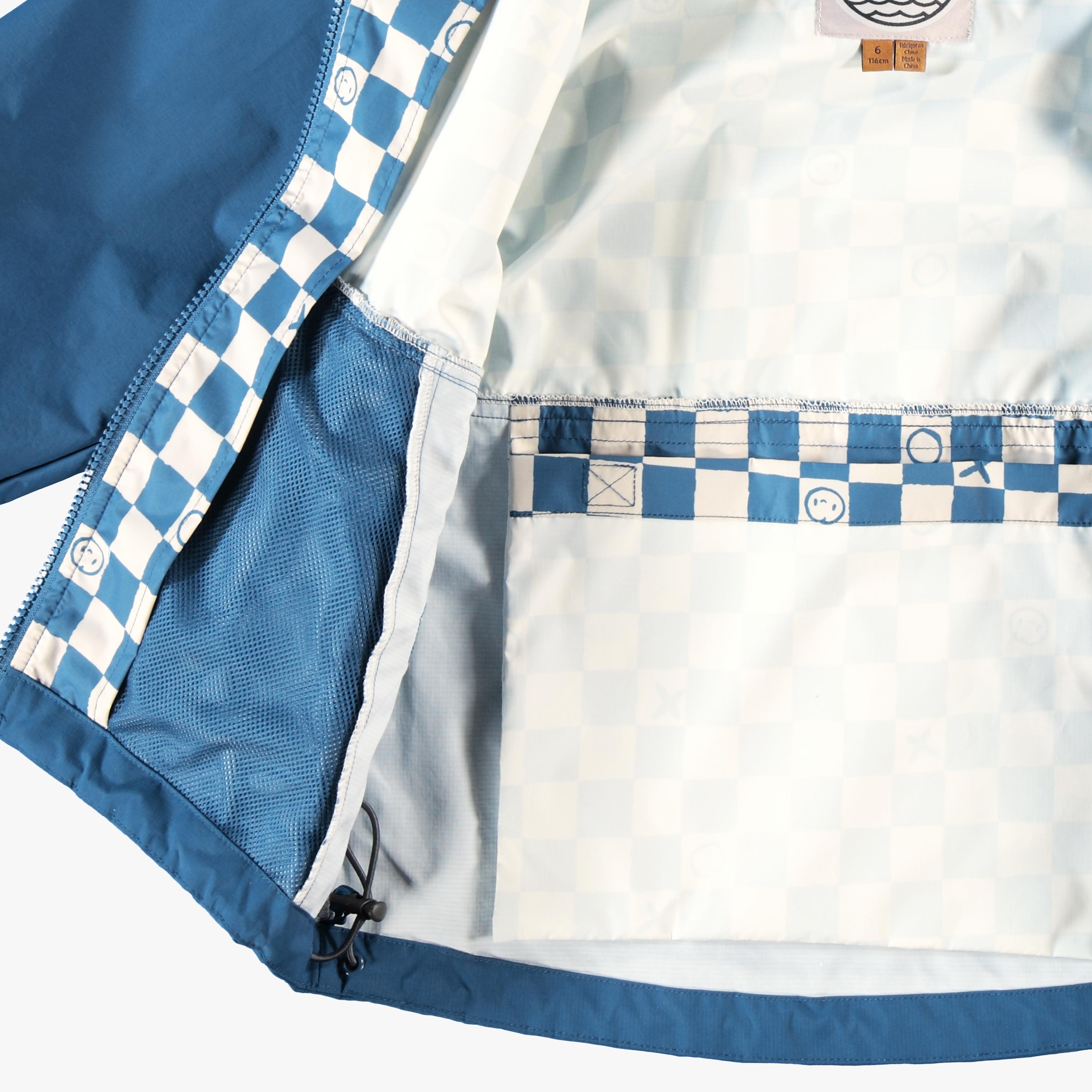 Manteau coupe-vent bleu à motif damier, enfant