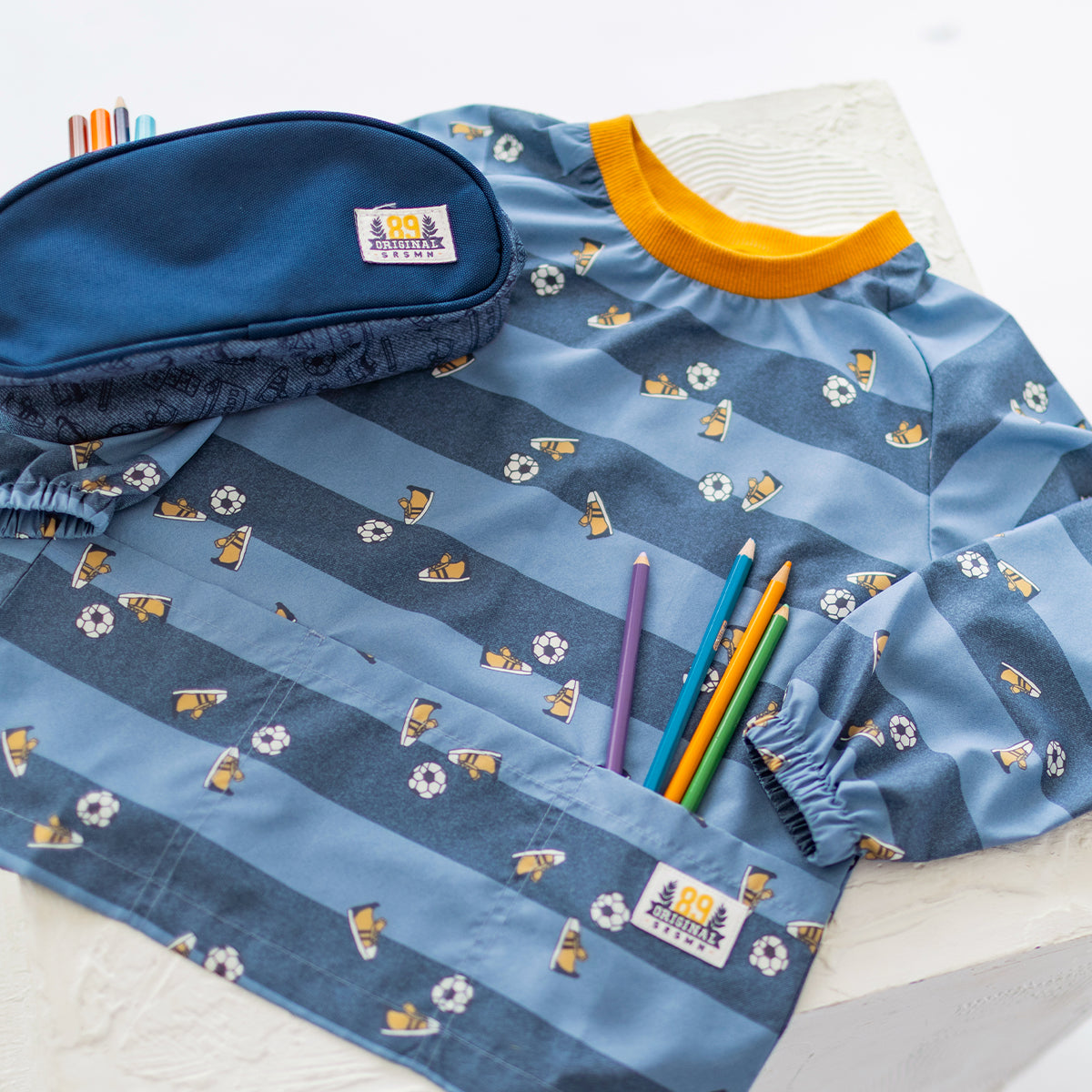 Blue printed smock, child