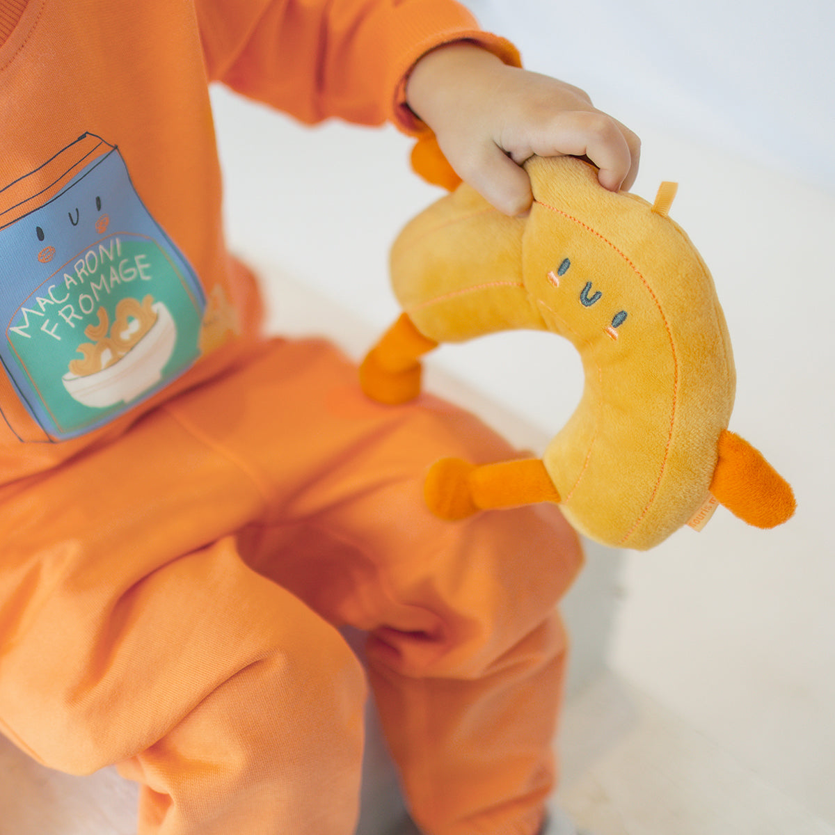 Peluche adorable en forme de macaroni