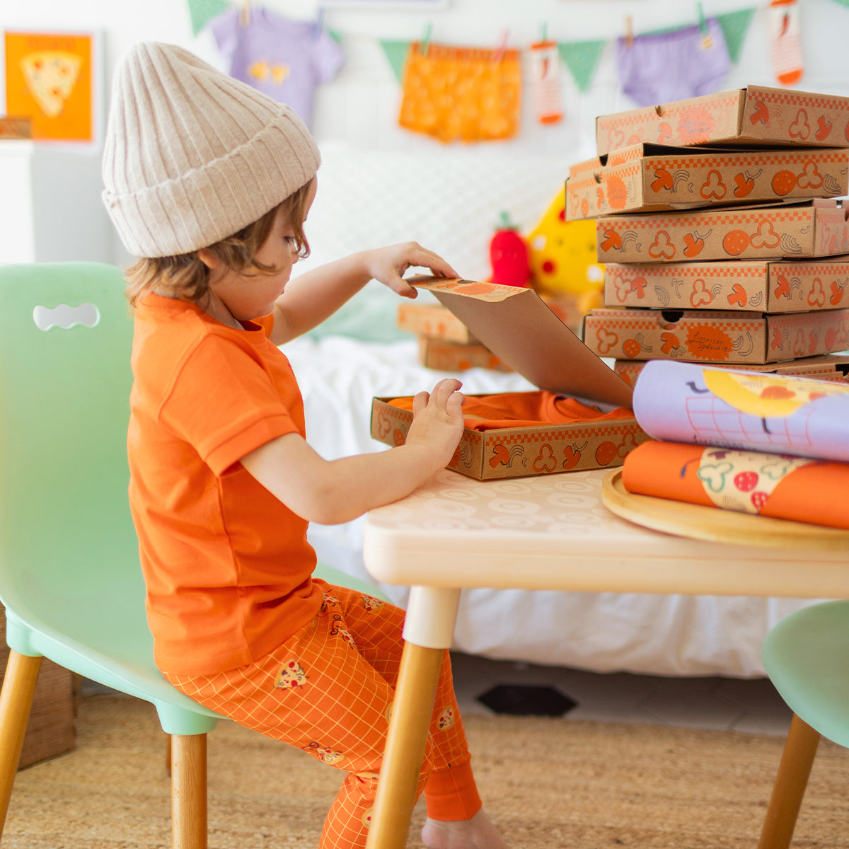 Orange two-piece pajamas with pizza patterns, baby