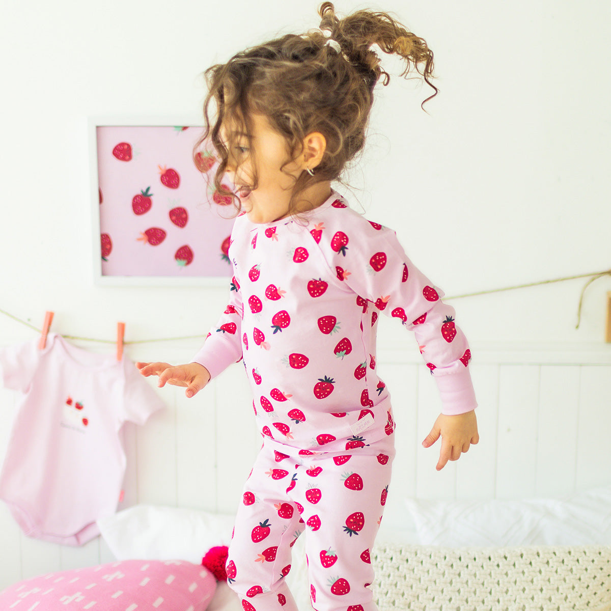 Pink two-piece pajamas with strawberry pattern, baby