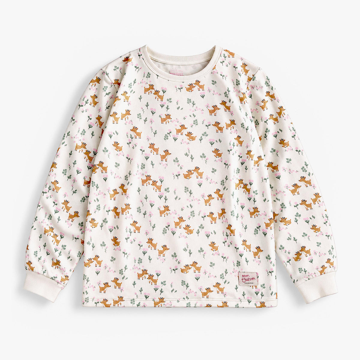Two-piece cream pajama set with fawn and foliage print, child