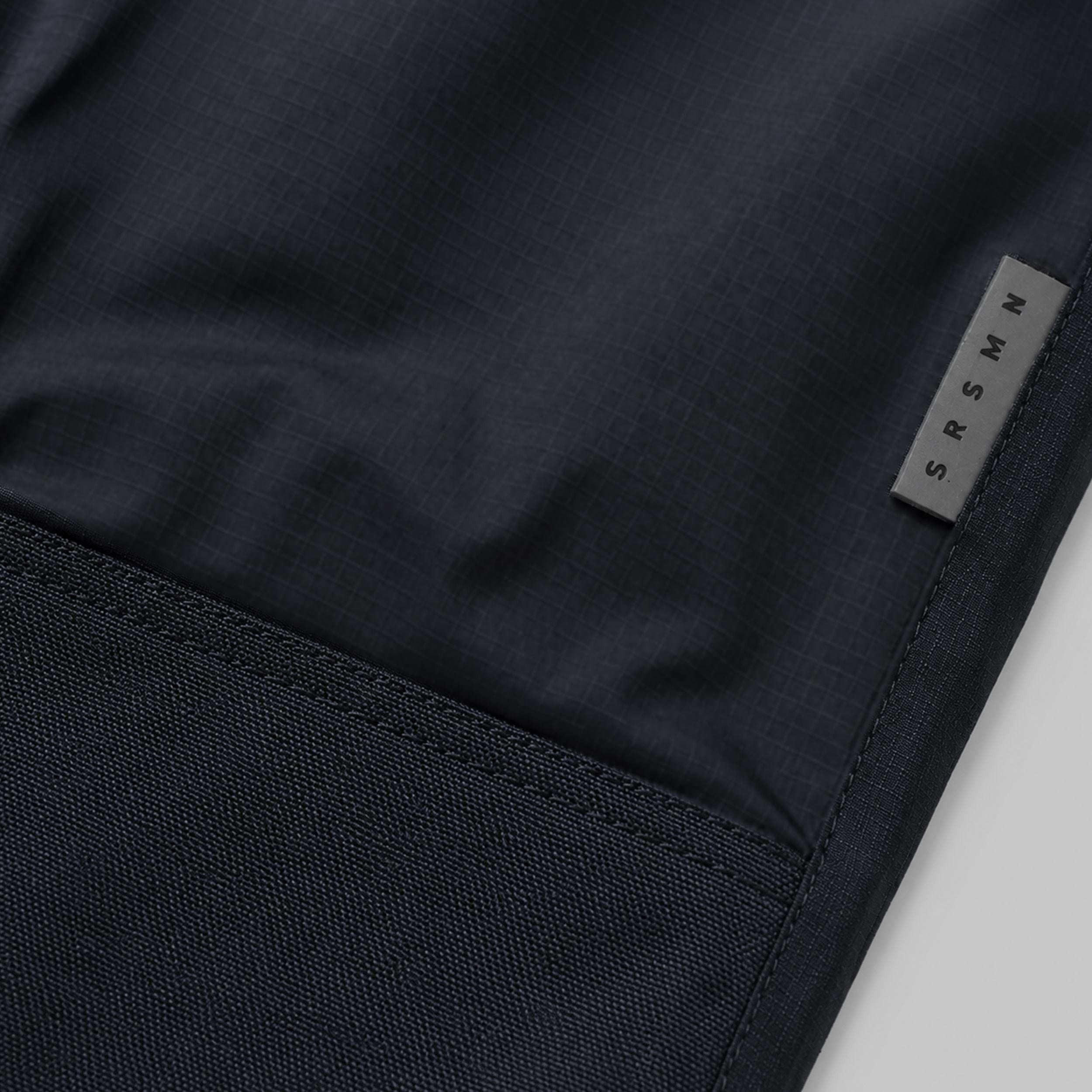 Black nylon outdoor pants, child
