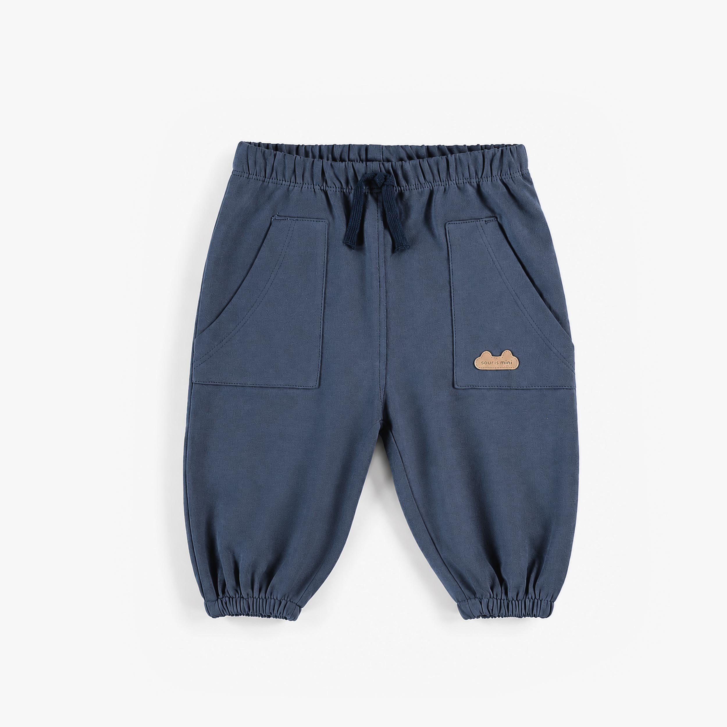 Pantalon bleu en coton français, naissance
