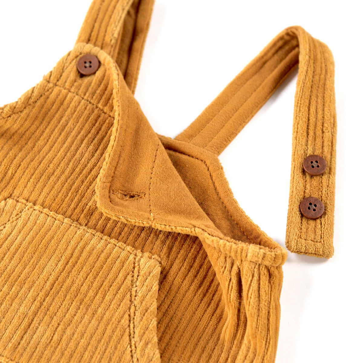 Salopette jaune ocre en velours côtelé extensible, naissance