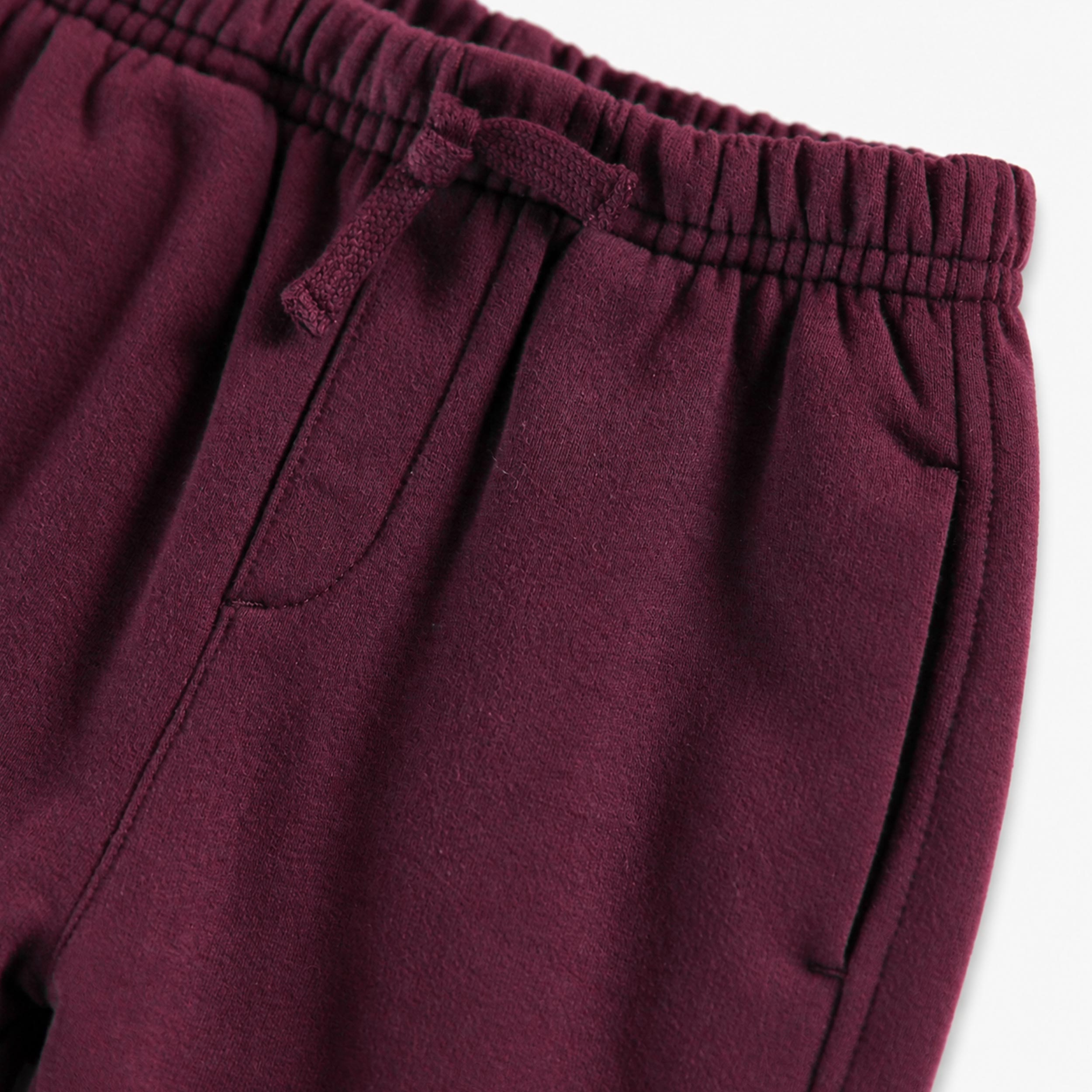 Burgundy fleece pants, baby
