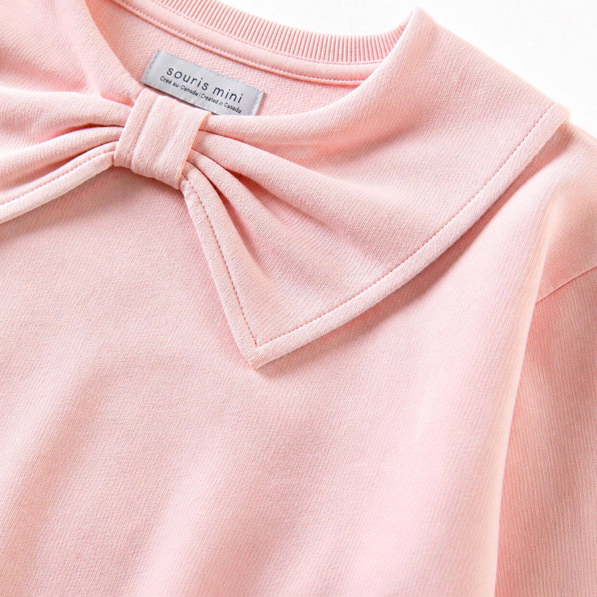 Pink sweater with bow collar, child