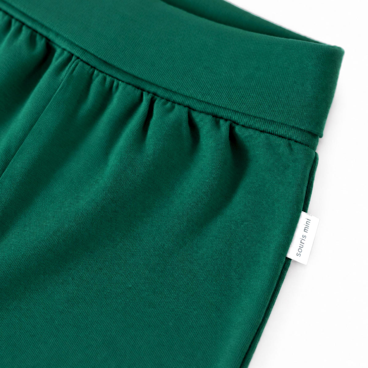Green grow-with-me pants, baby