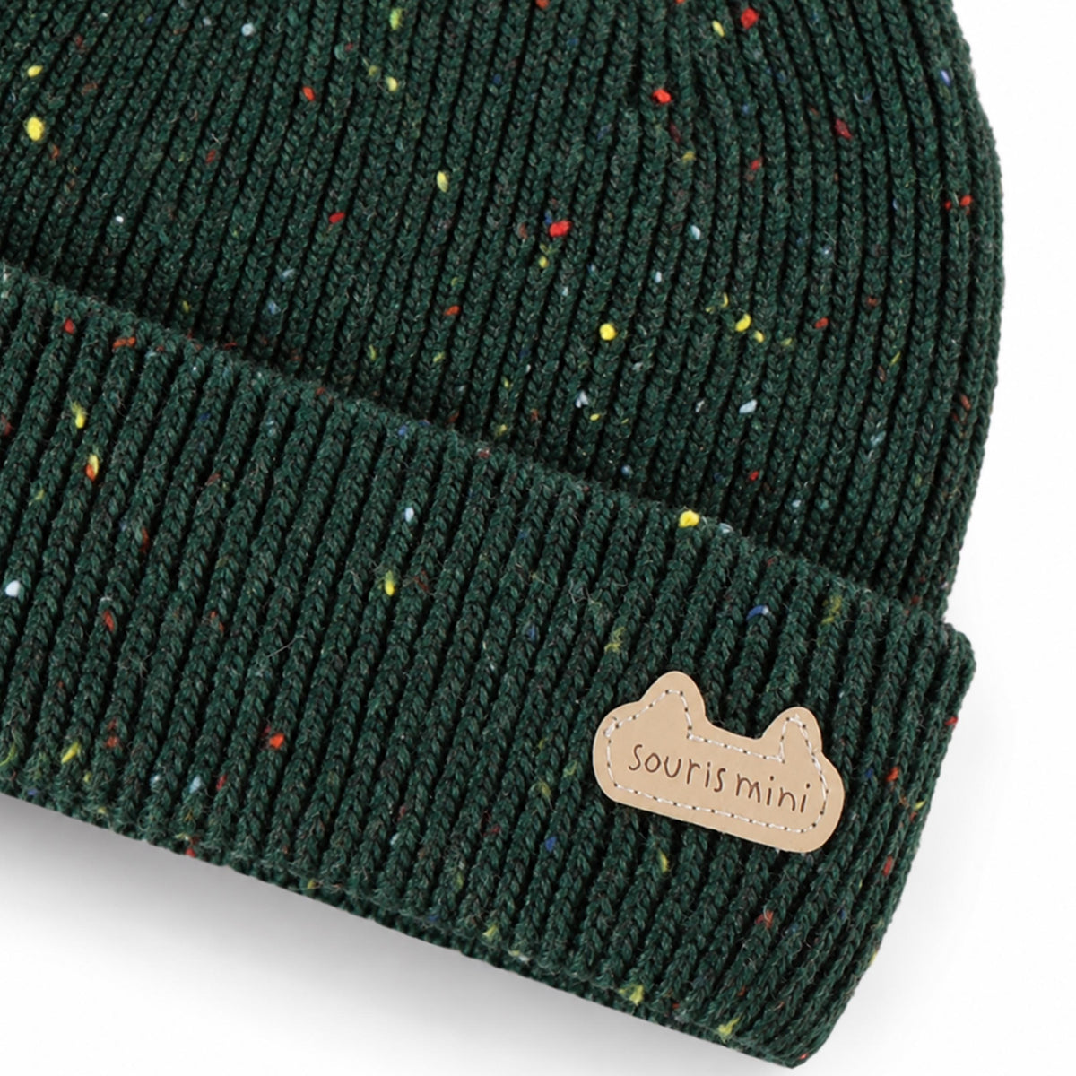 Tuque vert forêt en tricot moucheté, naissance