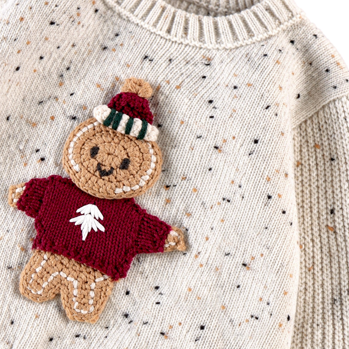 Chandail crème en tricot moucheté avec illustration, naissance