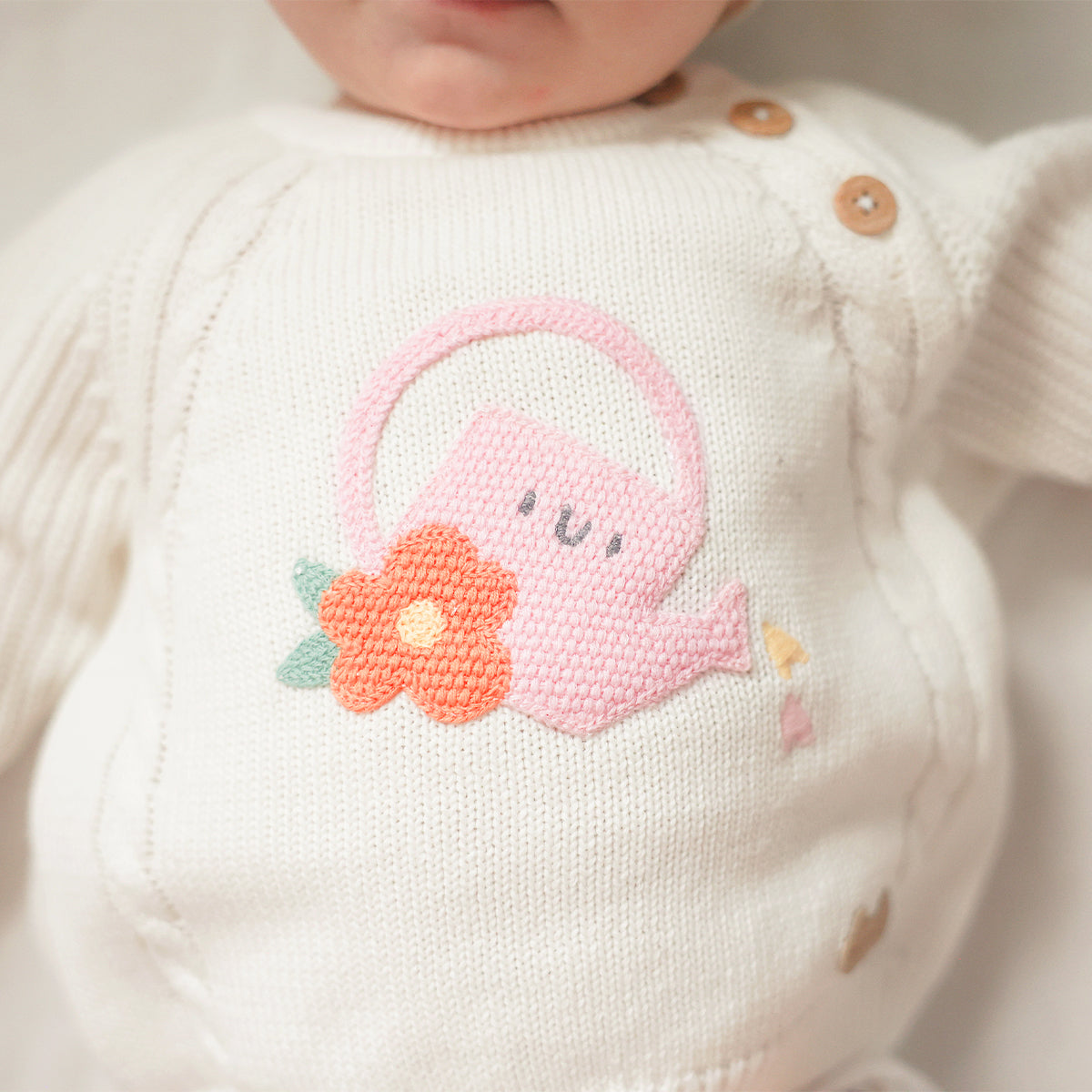 Chandail crème en tricot avec arrosoir, naissance