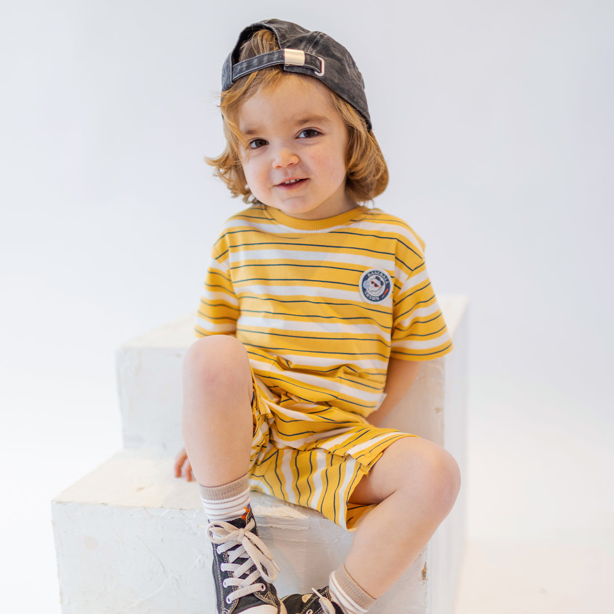 Yellow romper with white stripes, baby
