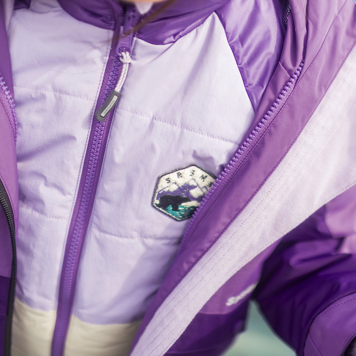 Zoom du manteau d’hiver 3 en 1 mauve, enfant