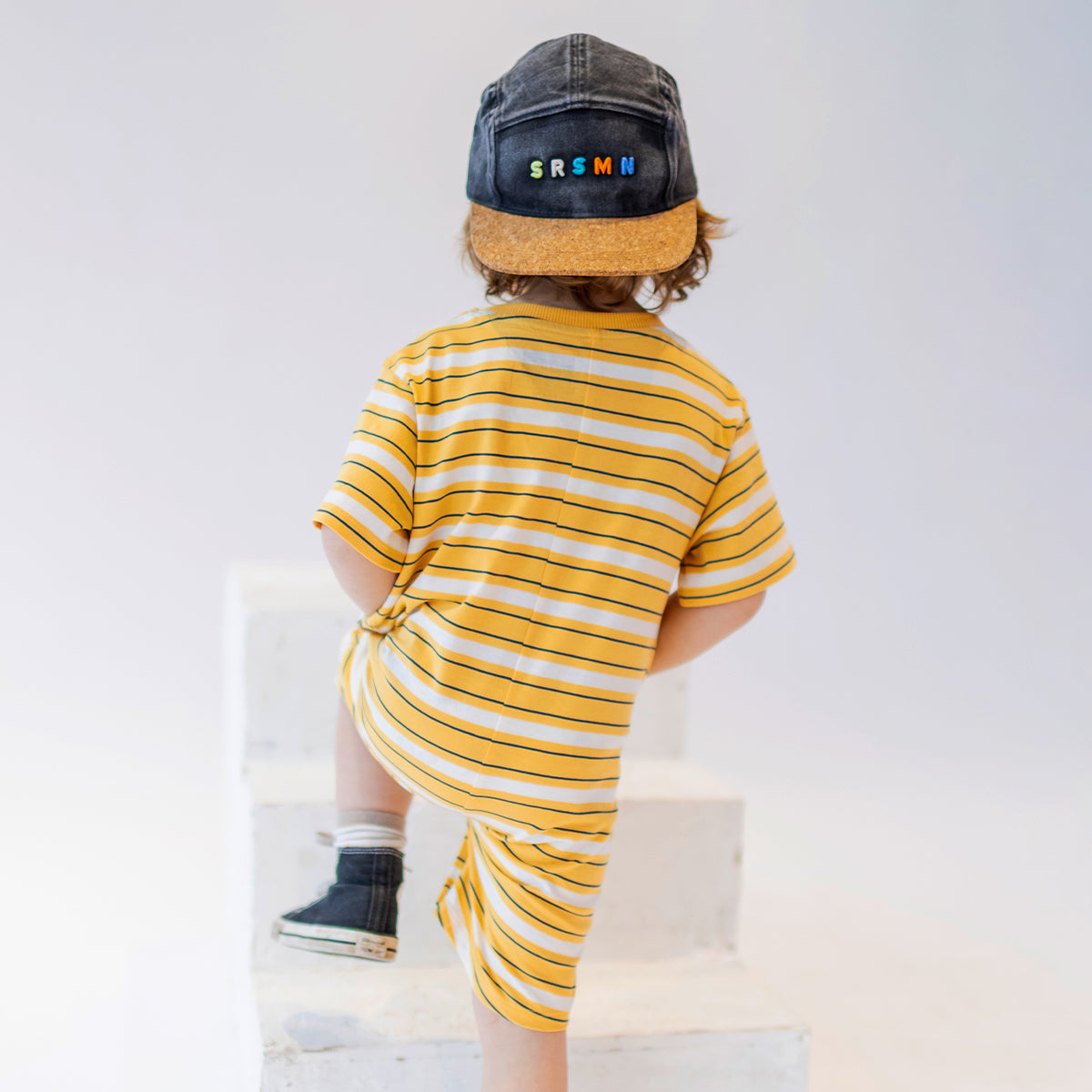 Yellow romper with white stripes, baby