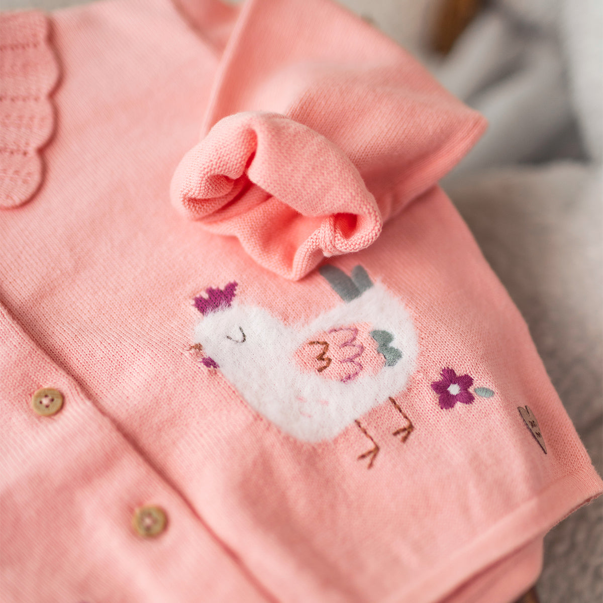Pink knit cardigan, baby