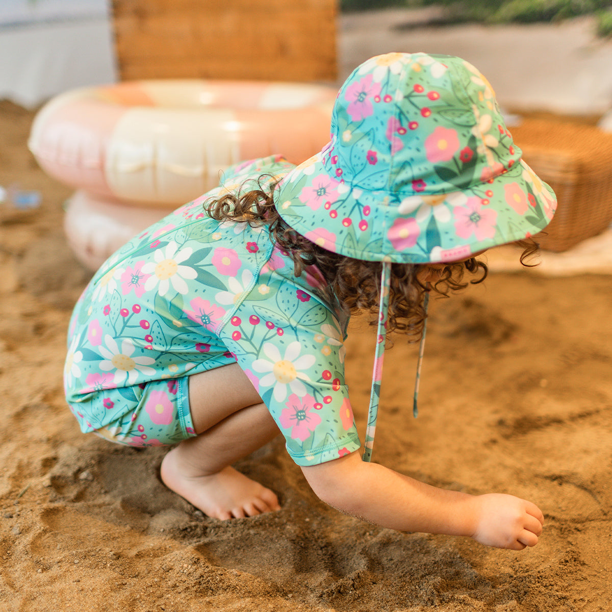 Reversible turquoise sun hat with floral pattern, baby