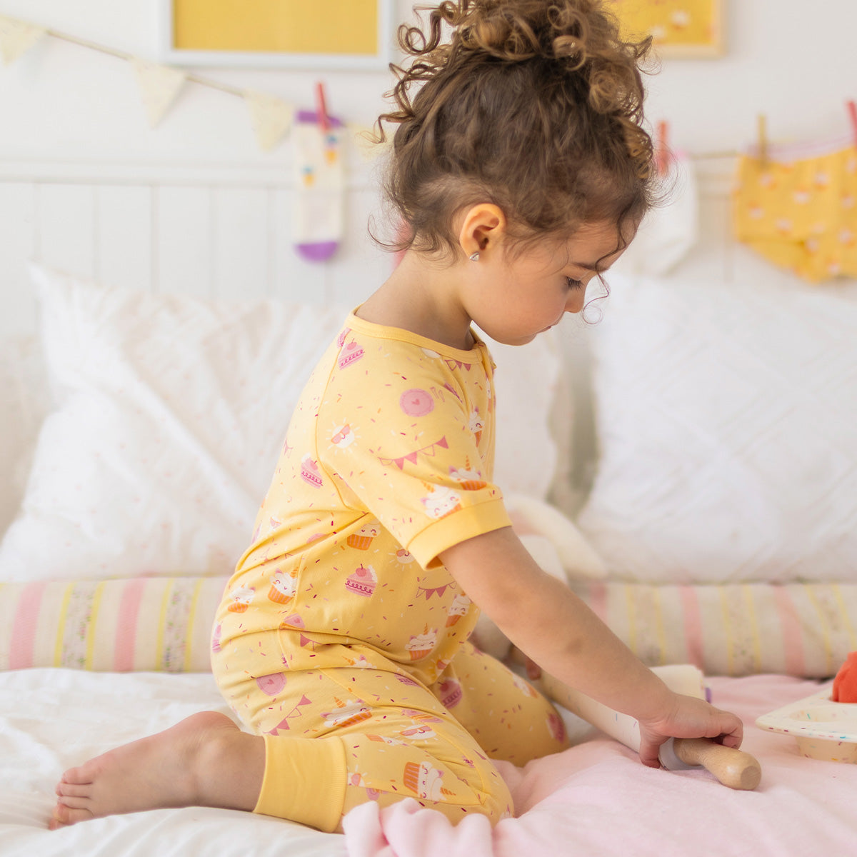 Yellow one-piece pajamas with cake print, baby