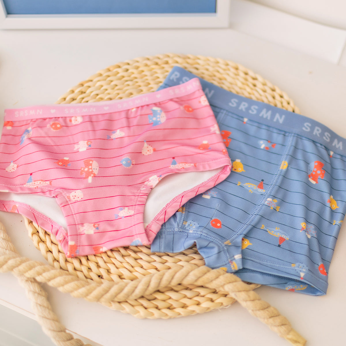 Blue boxer shorts with stripes and fish patterns, child