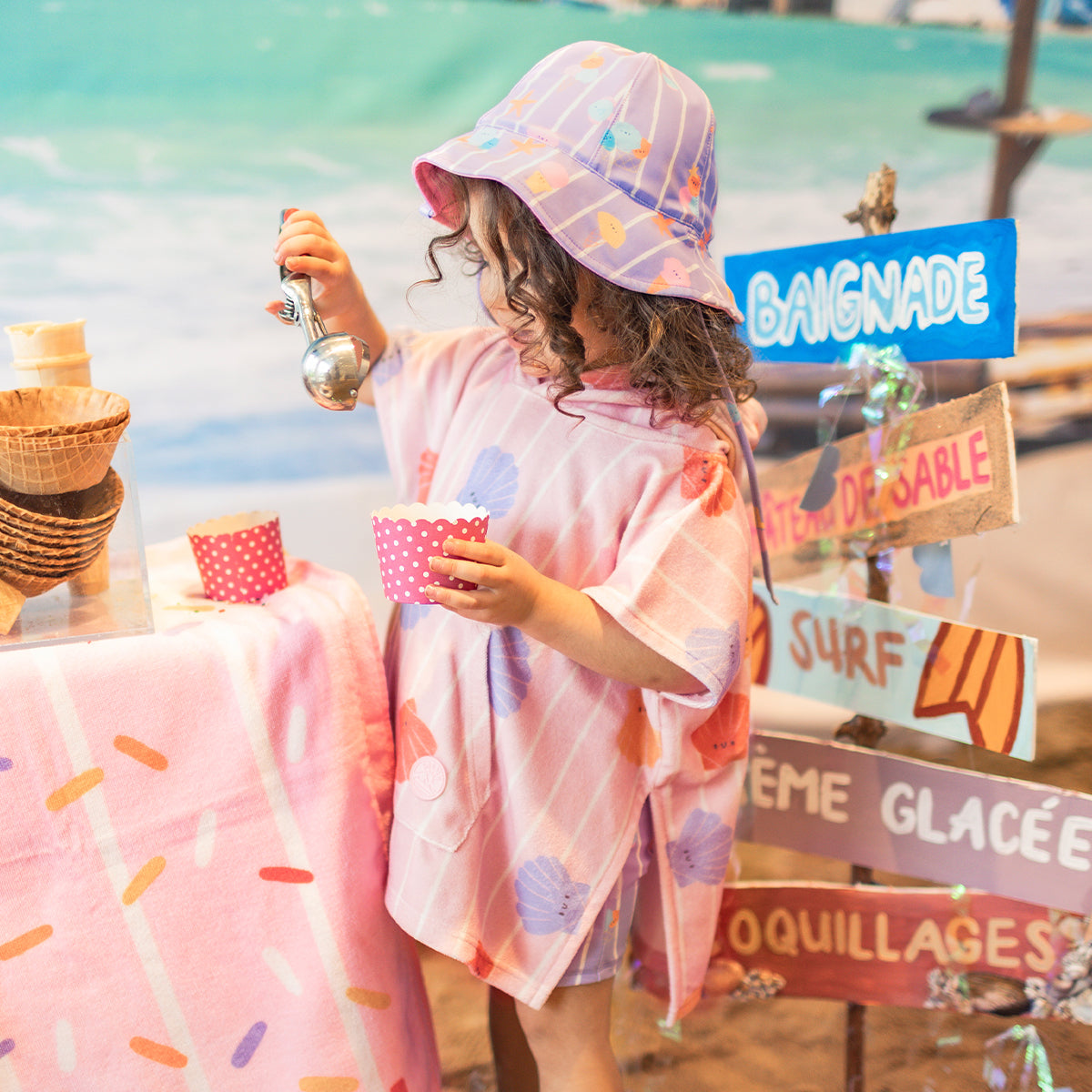 Pink beach poncho with stripes and seashells, baby