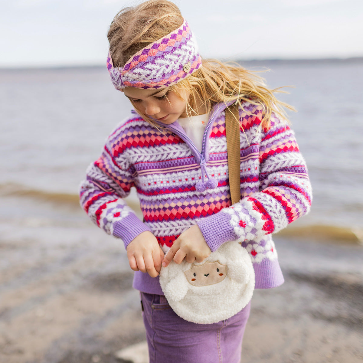 Purple knitted sweater with patterns, child