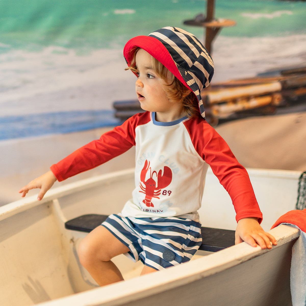 Bermuda de bain bleu et crème à rayures, bébé