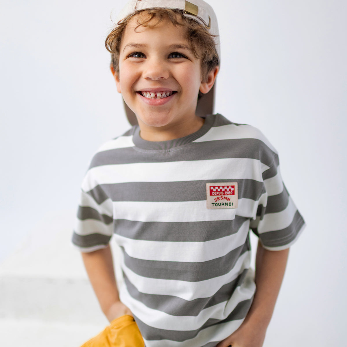 White and gray striped T-shirt, child