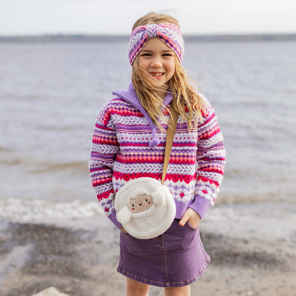Purple knitted sweater with patterns, child