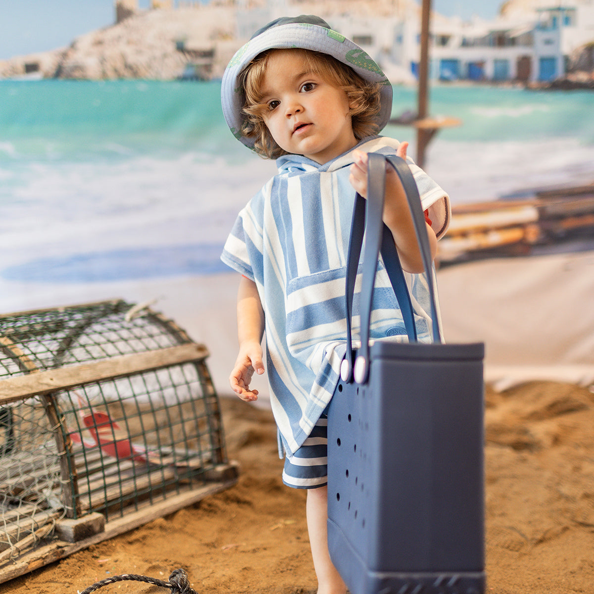 White beach poncho with blue stripes, baby