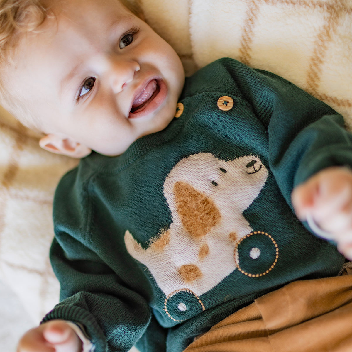 Chandail vert en tricot avec motif jacquard, naissance