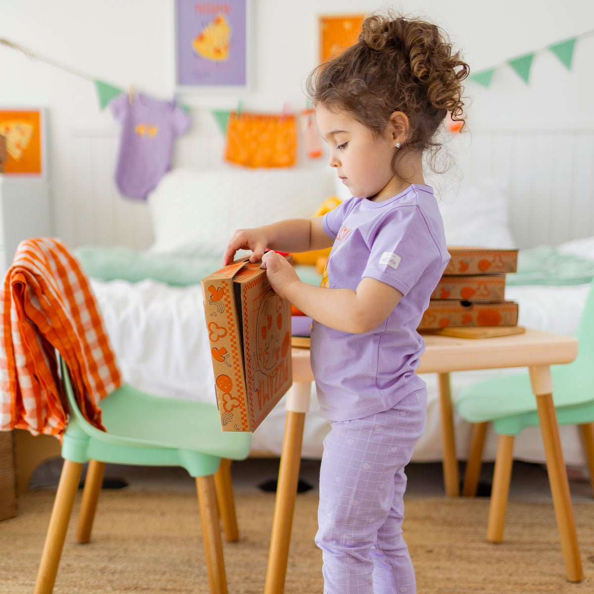 Two-piece purple pajamas with pizza patterns, baby