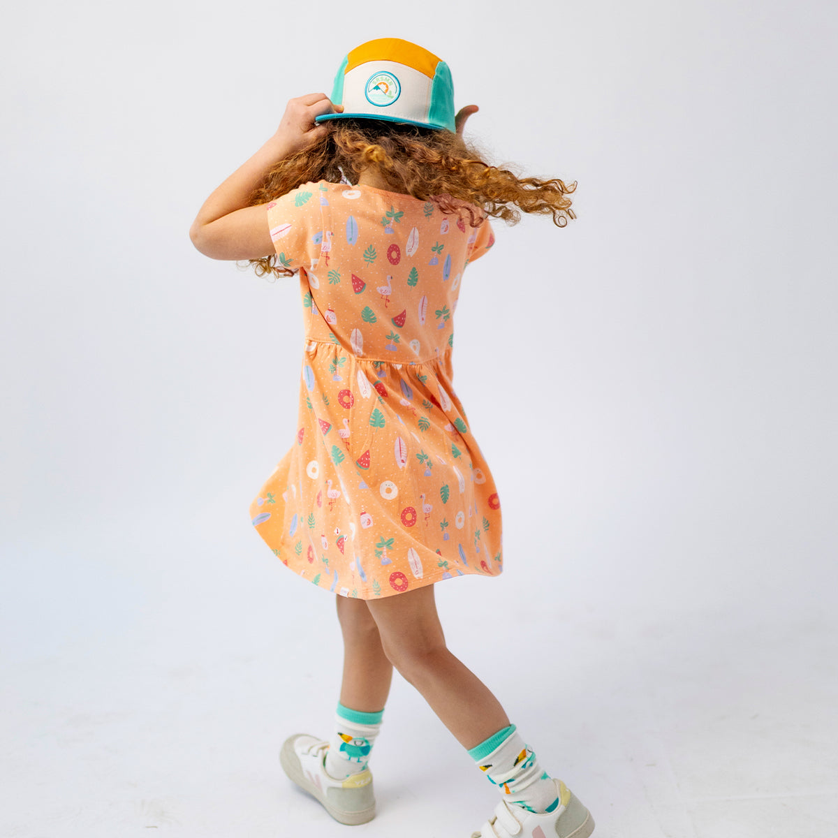 Orange patterned dress, child