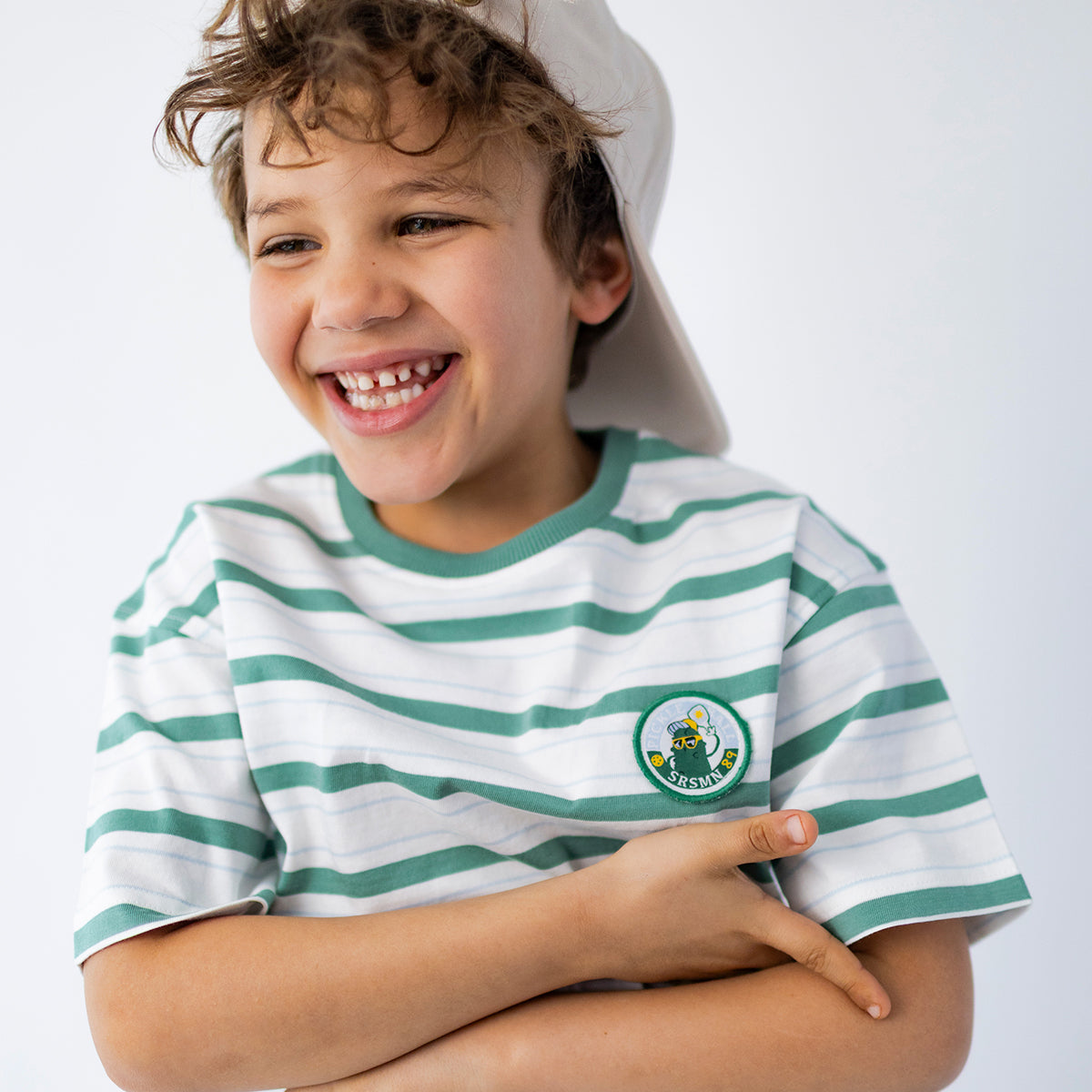White T-shirt with green and blue stripes, child