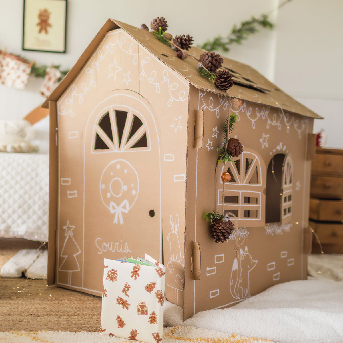 Holiday cardboard playhouse, child