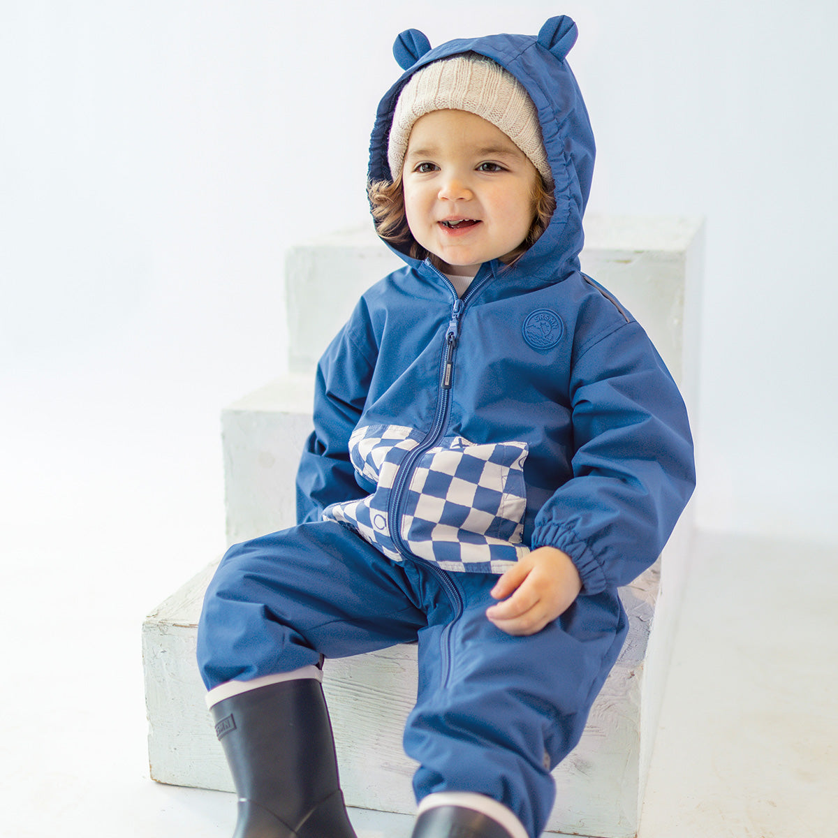 Blue one-piece jacket with checkerboard print, baby