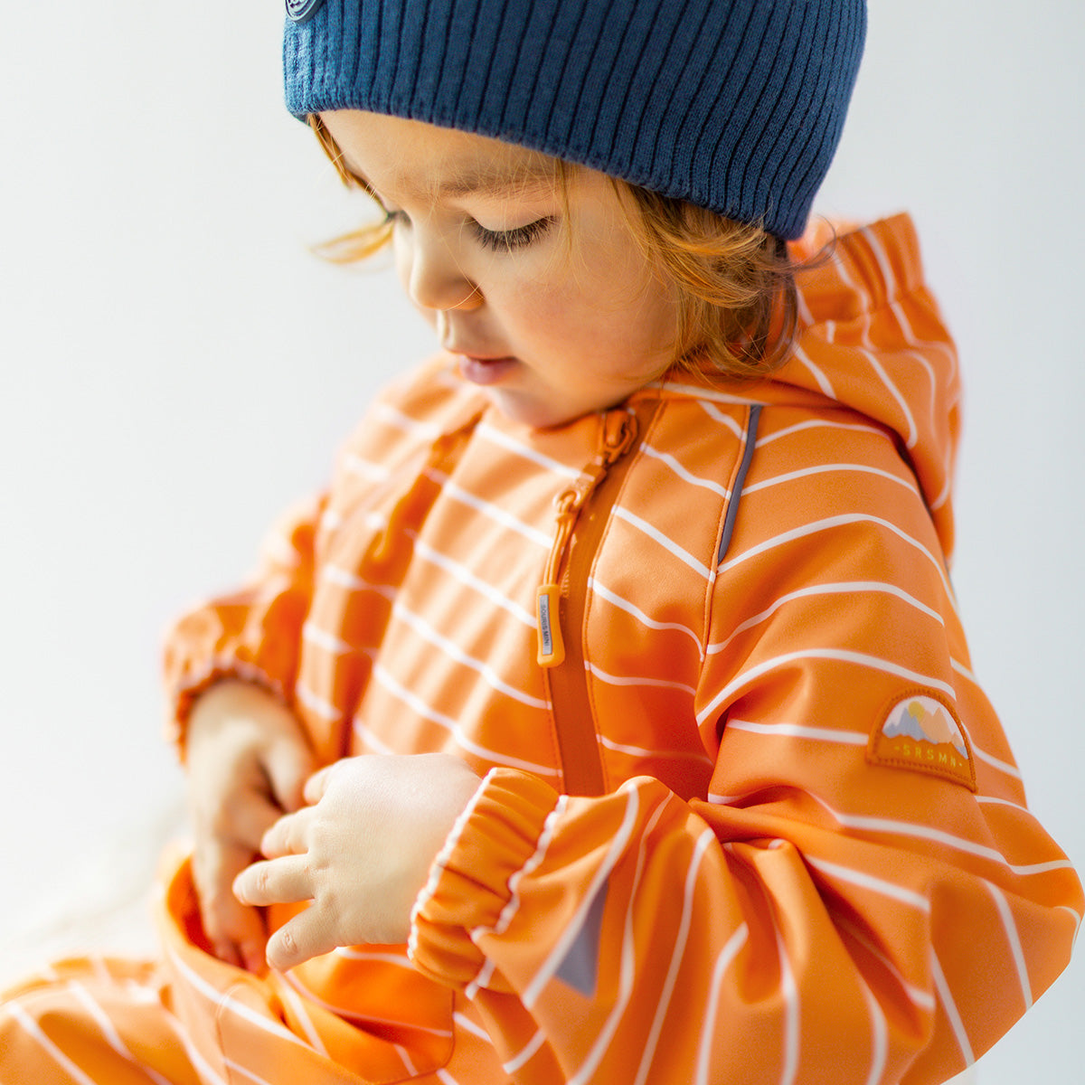 Manteau une pièce orange en coquille souple avec rayures, bébé