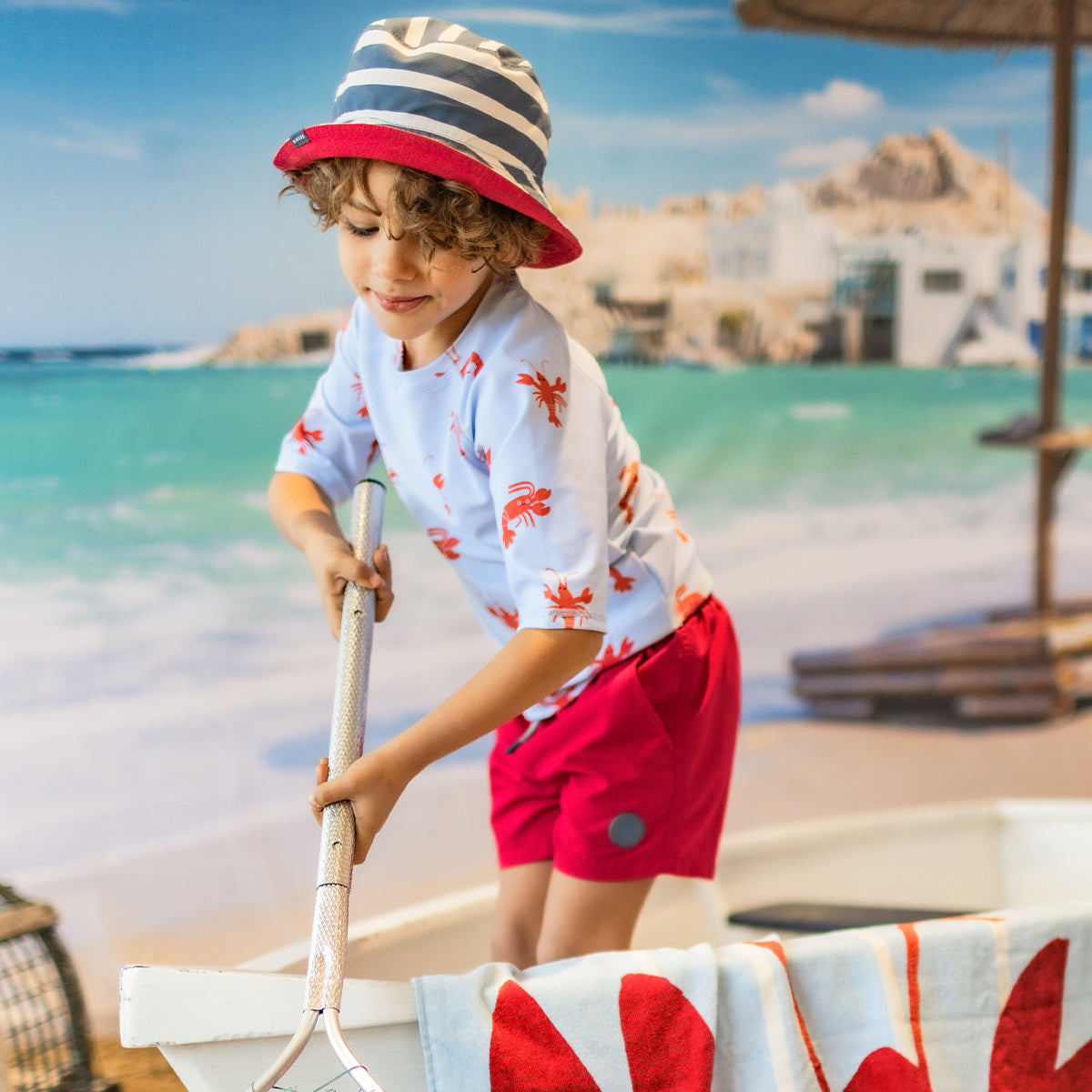Light blue swim shirt with lobster patterns, child