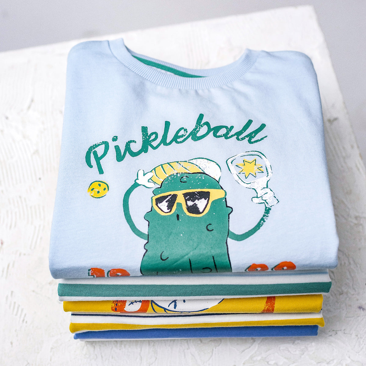 Light blue T-shirt with an illustration, child