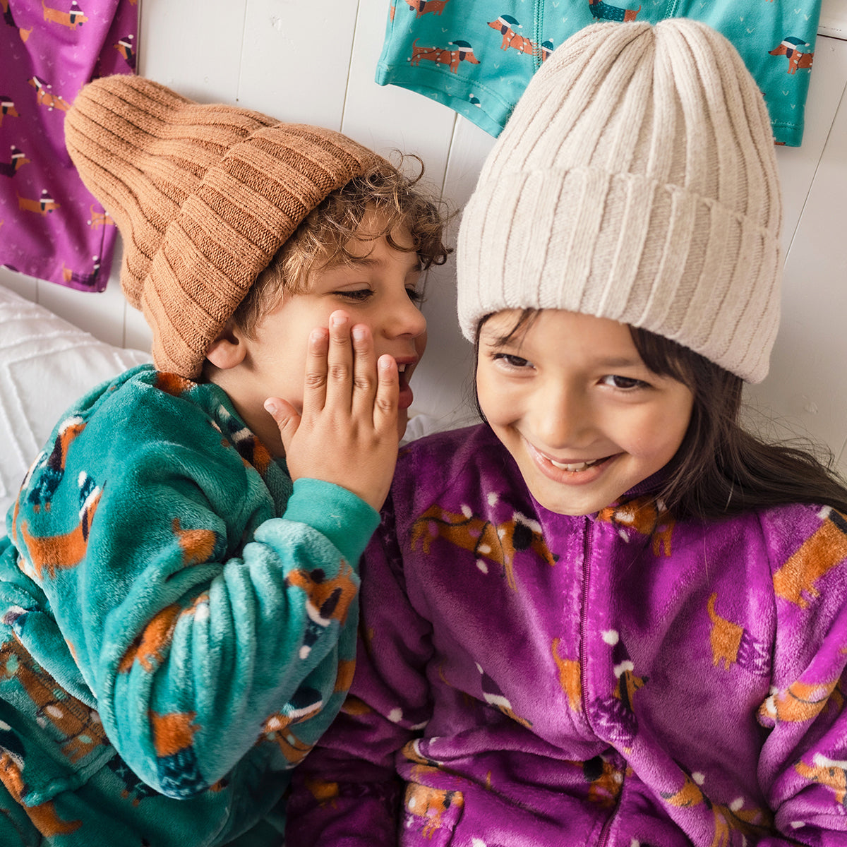 Turquoise plush one-piece pajamas with dog patterns, child