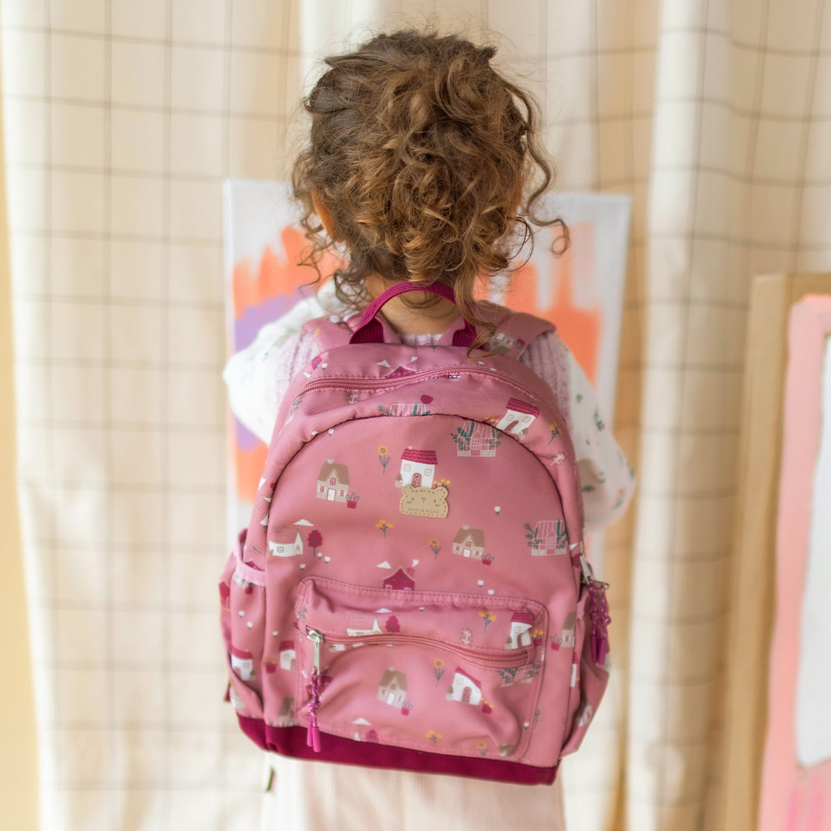 Sac à dos petit format rose à imprimé petites maisons