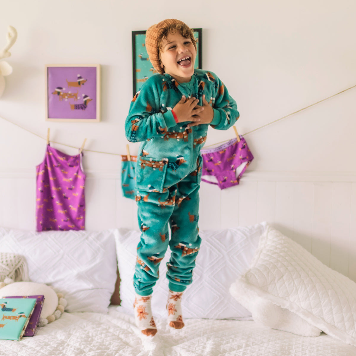 Turquoise plush one-piece pajamas with dog patterns, child