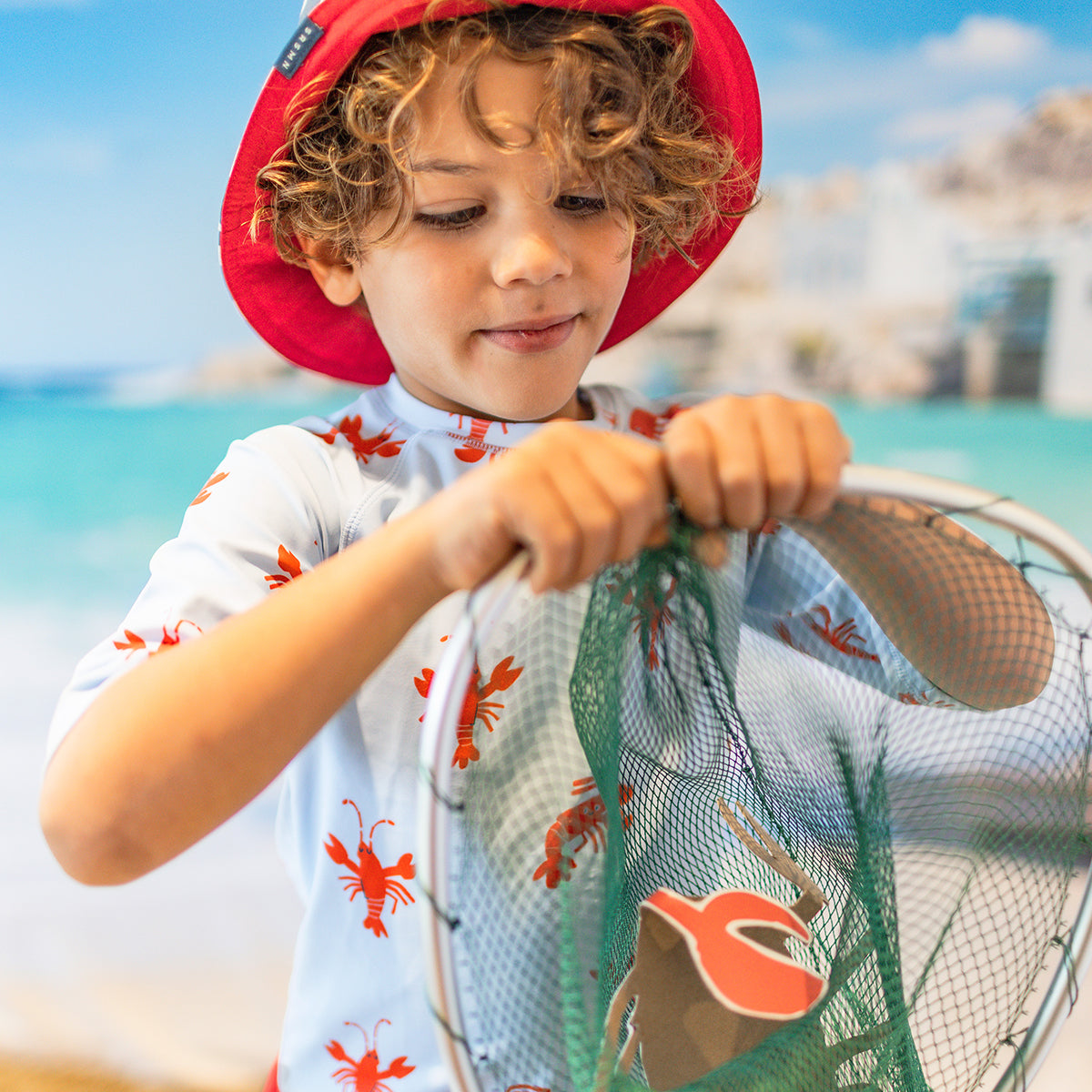 Light blue swim shirt with lobster patterns, child