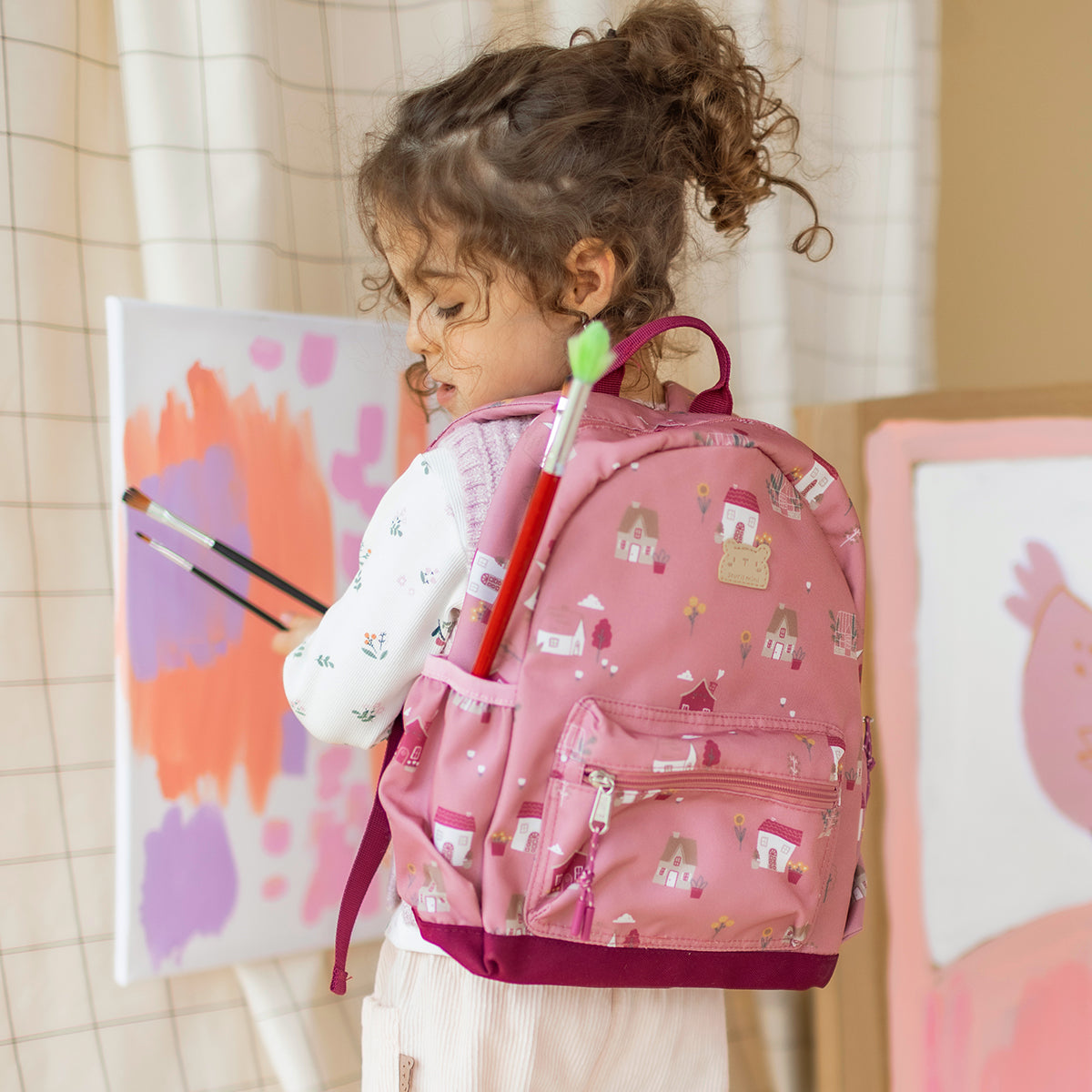 Sac à dos petit format rose à imprimé petites maisons