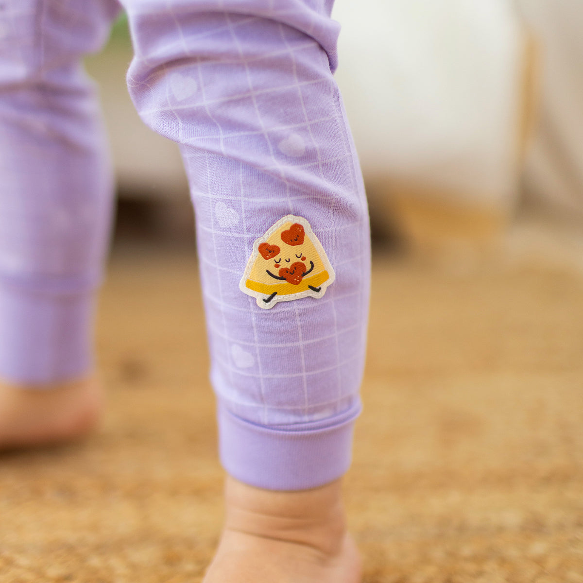 Two-piece purple pajamas with pizza patterns, baby
