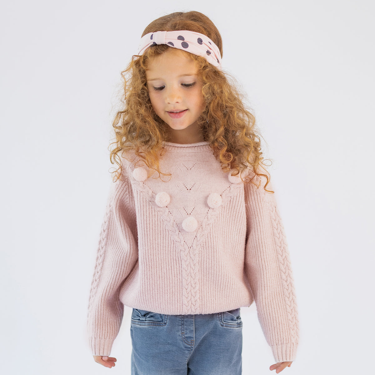 Chandail rose en tricot à pompons et torsades, enfant