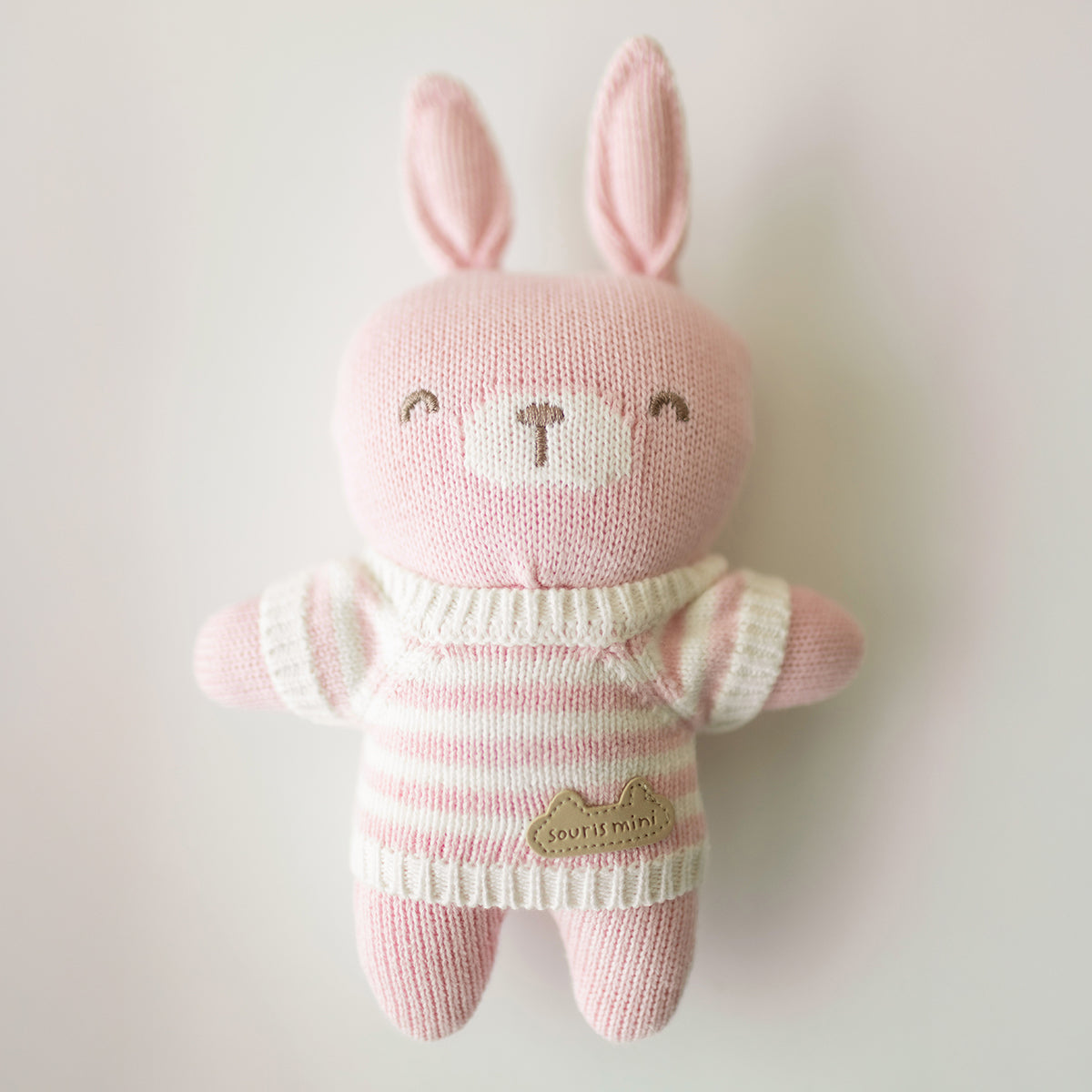 Pink knitted soft toy, newborn