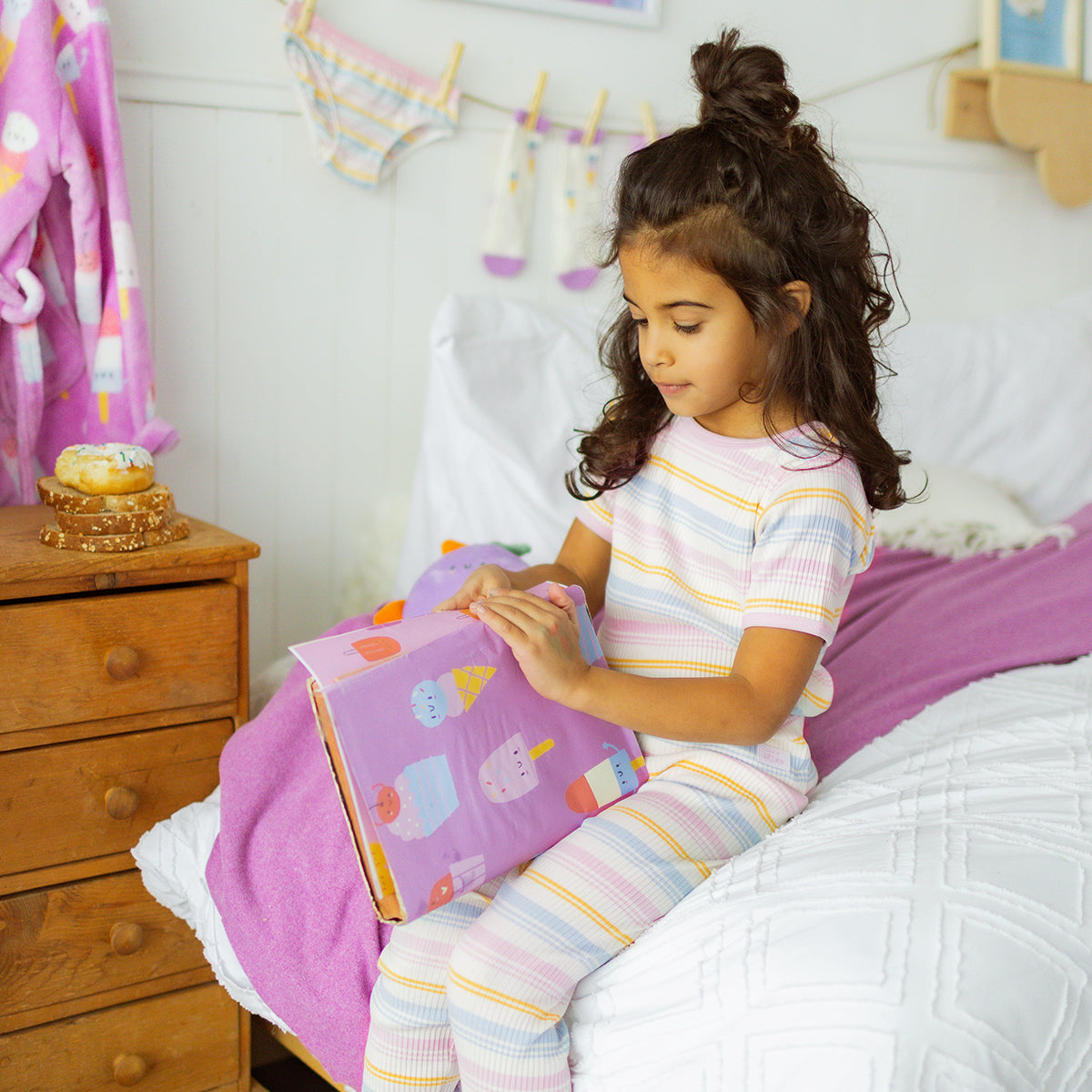 Two-piece cream pajamas with pastel stripes, child