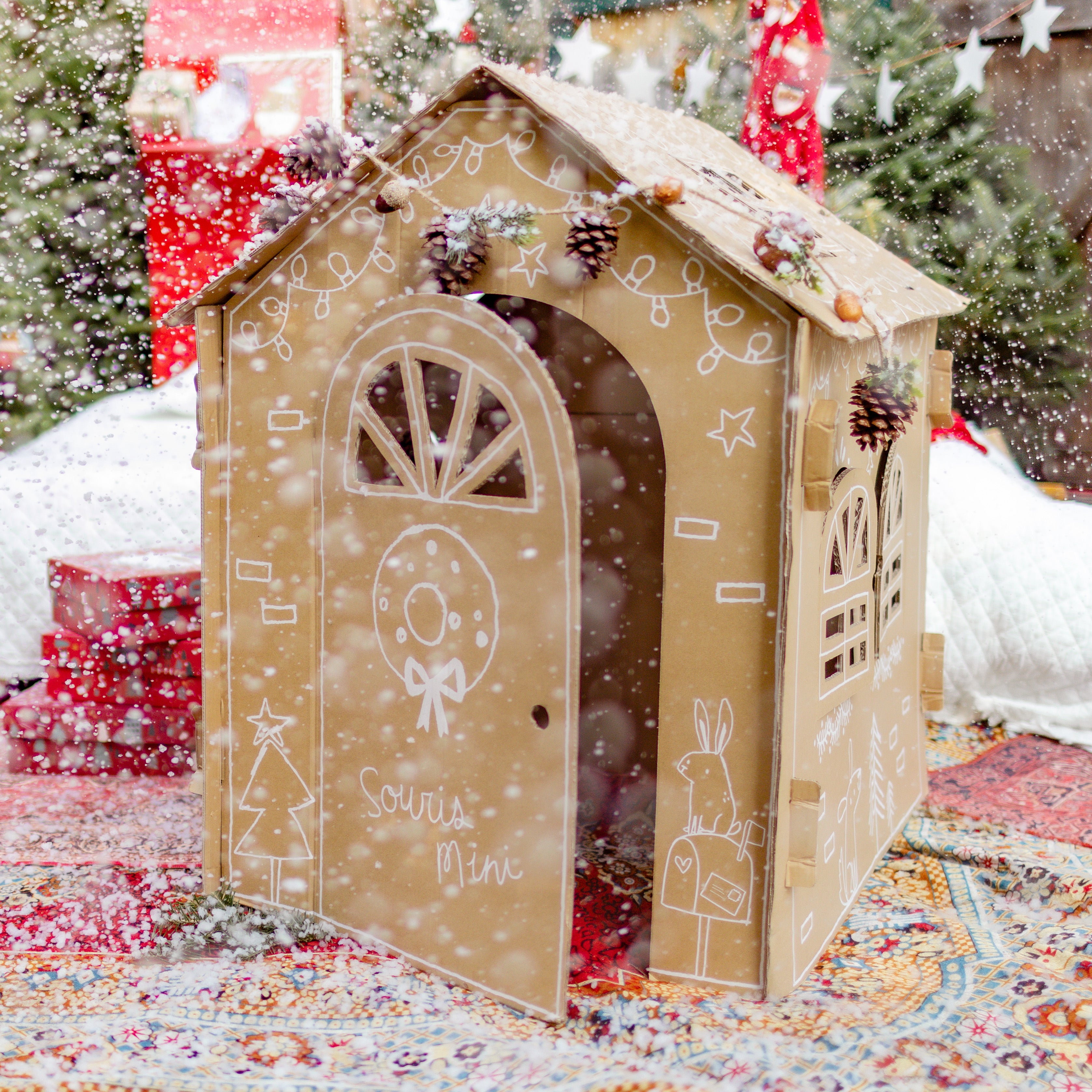 Holiday cardboard playhouse, child