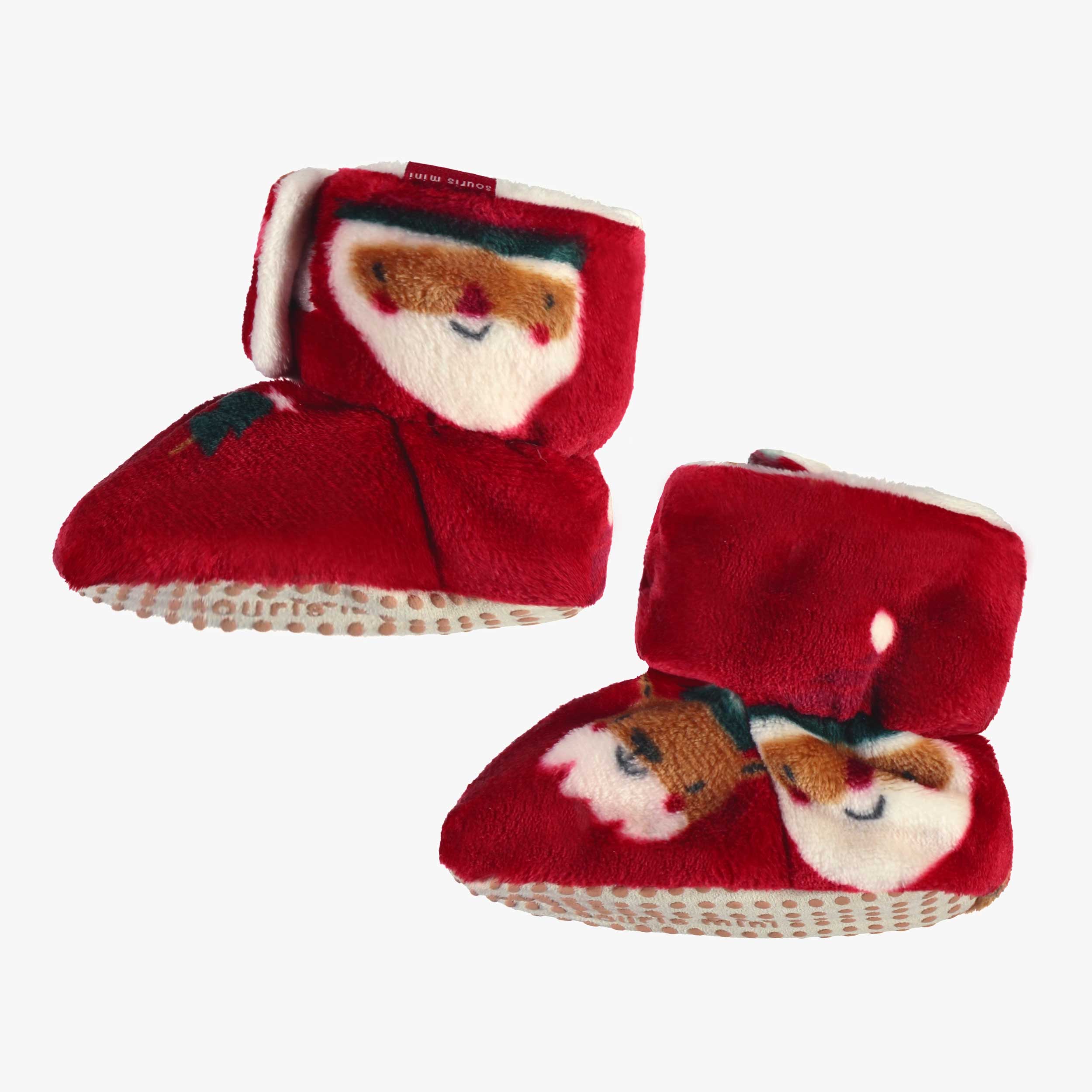 Vue de côté pantoufles rouges en peluche avec motifs des Fêtes, enfant