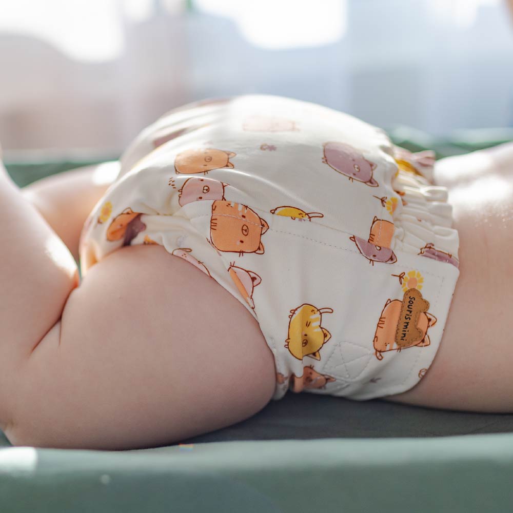 Ultra-thin cream reusable diaper with cat all over print, baby