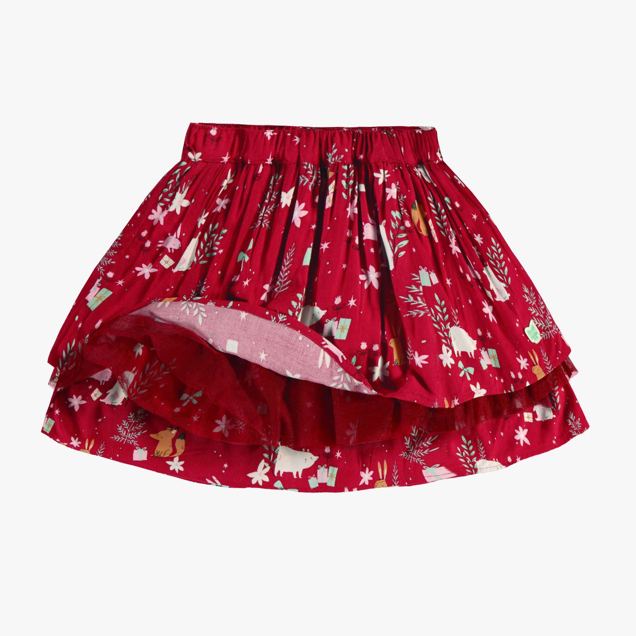 Détail de la jupe rouge à motifs festifs, enfant